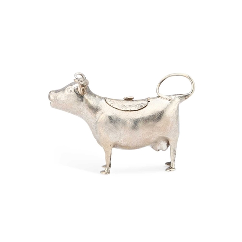 545 - A VICTORIAN SILVER COW CREAMER by William Comyns & Sons, London 1881, typically modelled standin... 