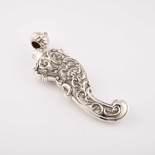 553 - A LARGE VICTORIAN SILVER SCENT BOTTLE marks rubbed, of scroll-form, chased with scrolls and foliage,... 