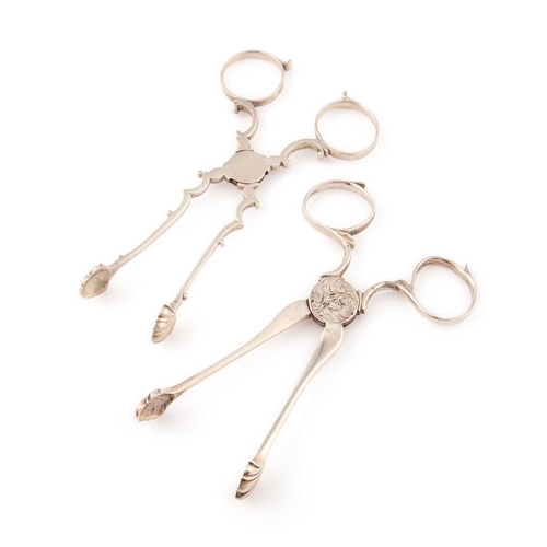 582 - TWO PAIRS OF GEORGE III SILVER SUGAR TONGS the first pair by William Harrison I, London, c.1770; the... 