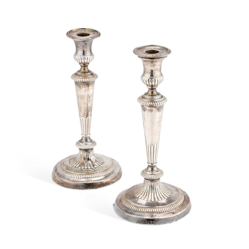 587 - A PAIR OF GEORGE III SILVER CANDLESTICKS by John Roberts & Co, Sheffield, possibly 1810, of tape... 