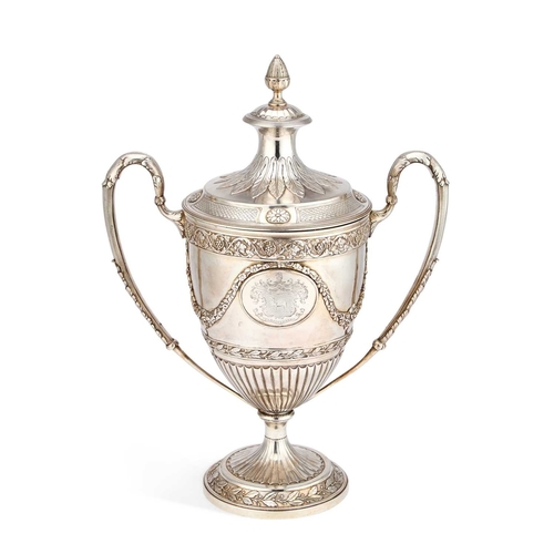 598 - A GEORGE III SILVER-GILT TWO-HANDLED CUP AND COVER by William Holmes, London 1801, the trophy in the... 