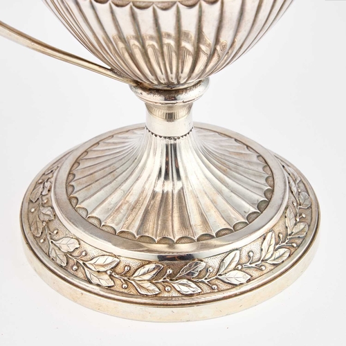 598 - A GEORGE III SILVER-GILT TWO-HANDLED CUP AND COVER by William Holmes, London 1801, the trophy in the... 