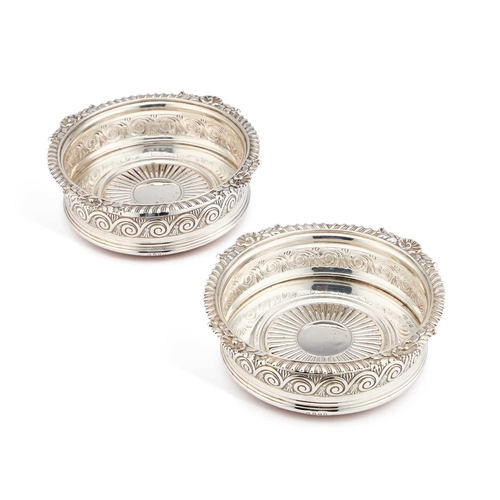 602 - A PAIR OF GEORGE III SILVER COASTERS by Solomon Hougham, London 1812, with shell and foliate decorat... 