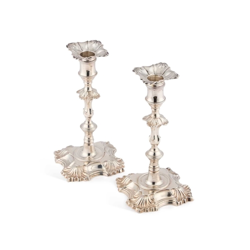 632 - A PAIR OF GEORGE II CAST SILVER CANDLESTICKS by William Cafe, London 1759, each with a knopped stem ... 