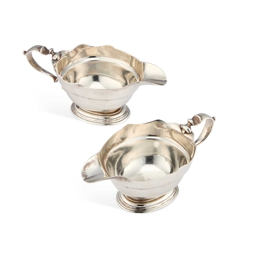 638 - A PAIR OF GEORGE II SILVER SAUCEBOATS by William Paradise, London 1729, oval form with a wavy-edge b... 