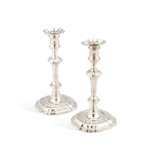 640 - A PAIR OF LATE GEORGE II SILVER CANDLESTICKS by William Cafe, London 1759, each with a shaped square... 