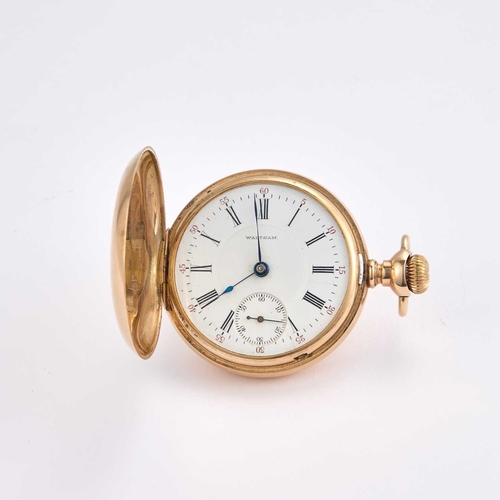 667 - A 14K GOLD WALTHAM HUNTER POCKET WATCH the circular white enamel dial signed Waltham, with black Rom... 