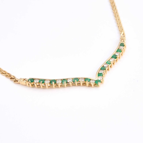 722 - AN EMERALD AND DIAMOND NECKLACE the front set with round brilliant-cut diamonds and round-cut emeral... 