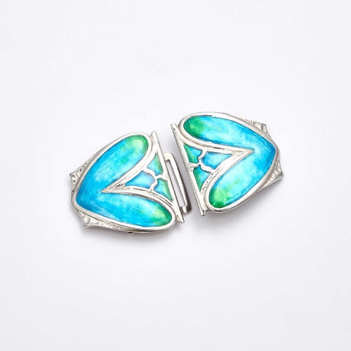 750 - ARCHIBALD KNOX (1864-1933) FOR LIBERTY & CO, A SILVER AND ENAMEL TWO PART BUCKLE of two abstract lea... 