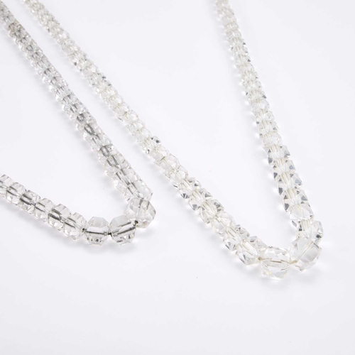 758 - TWO GRADUATED FACETED ROCK CRYSTAL BEAD NECKLACES one with a clasp stamped 'SILVER'. (2) 79cm and 80... 