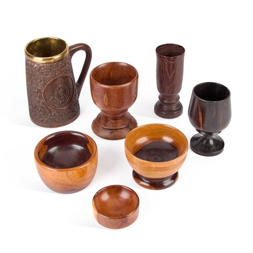 81 - A COLLECTION OF TREEN GOBLETS AND BOWLS including a carved Royal Army Medical Corps tankard, lignum ... 