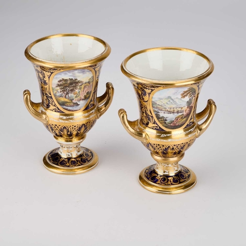 813 - A PAIR OF DERBY PORCELAIN CAMPANA VASES, CIRCA 1810 each ground in cobalt blue, gilded and with a pa... 