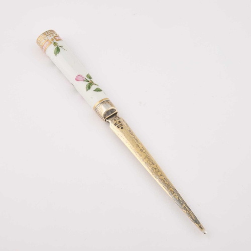 824 - A ROYAL COPENHAGEN SILVER-GILT MOUNTED 'FLORA DANICA' LETTER OPENER the silver by A. Michelsen, Cope... 