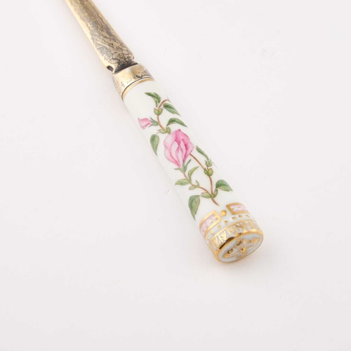 824 - A ROYAL COPENHAGEN SILVER-GILT MOUNTED 'FLORA DANICA' LETTER OPENER the silver by A. Michelsen, Cope... 