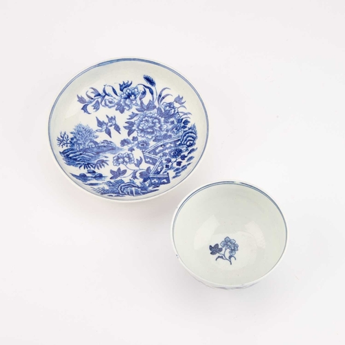 831 - A WORCESTER BLUE AND WHITE TEA BOWL AND SAUCER, CIRCA 1780 decorated with the Fence pattern, crescen... 