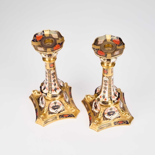 837 - A PAIR OF ROYAL CROWN DERBY IMARI CANDLESTICKS pattern no. 1128. (2) 26.7cm high