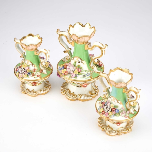 841 - AN EARLY 19TH CENTURY DERBY GARNITURE each painted in pale green, with applied floral sprays, height... 