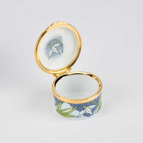 848 - THREE PIECES OF MOORCROFT ENAMEL comprising a box painted with a snowdrop, cased; a limited edition ... 