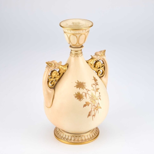 851 - A ROYAL WORCESTER VASE the ovoid body gilt-painted with floral sprays, with twin dragon-form handles... 