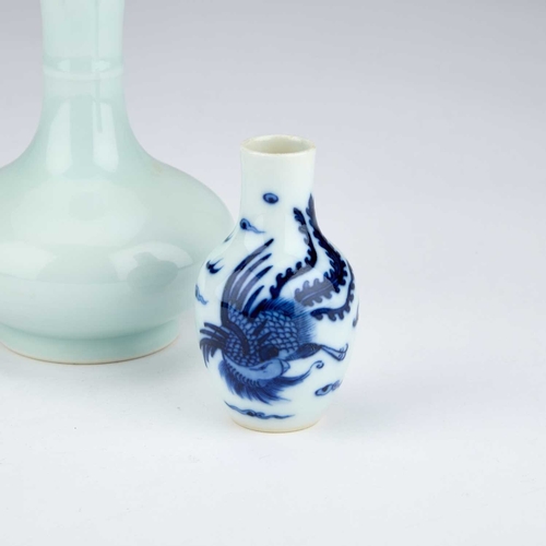 884 - A CHINESE BOTTLE-SHAPED CELADON VASE AND A SMALL CHINESE BLUE AND WHITE 'DRAGON AND PHOENIX' VASE ea... 