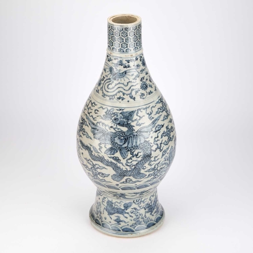 887 - A LARGE CHINESE YUAN-STYLE BLUE AND WHITE PEAR-SHAPED 'DRAGON' VASE decorated with dragons above cra... 