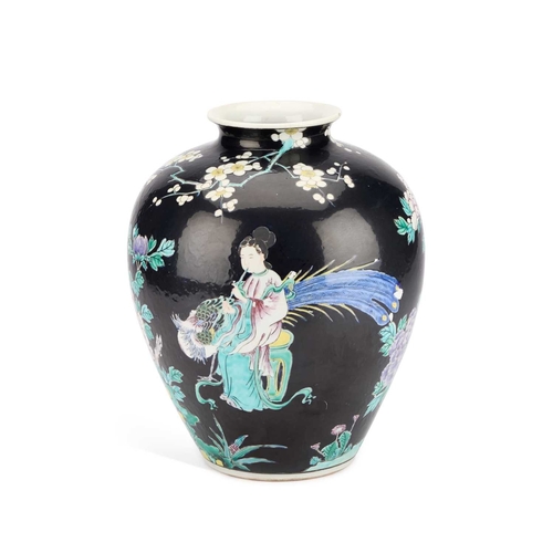 907 - A LARGE CHINESE FAMILLE NOIRE VASE enamel painted with figures, phoenix and flowers, indistinct iron... 