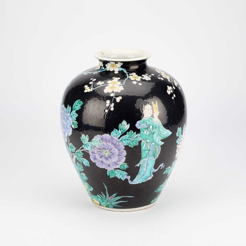 907 - A LARGE CHINESE FAMILLE NOIRE VASE enamel painted with figures, phoenix and flowers, indistinct iron... 