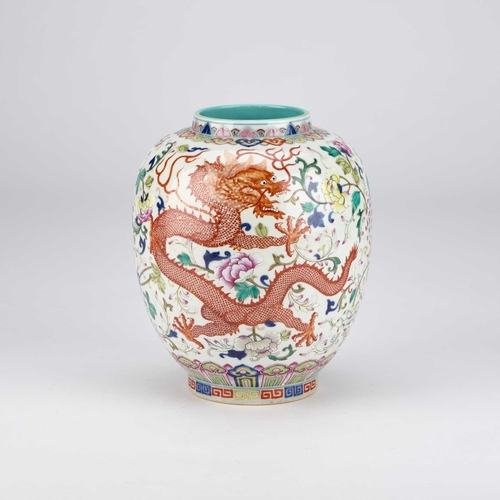 911 - A CHINESE FAMILLE ROSE 'DRAGON AND PHOENIX' VASE ovoid, enamel painted with a dragon and phoenix ami... 