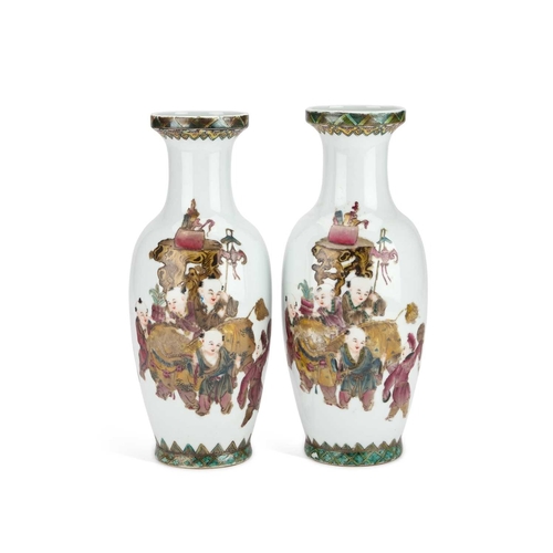 913 - A PAIR OF CHINESE VASES each of baluster form, enamel painted with a procession of figures to one si... 