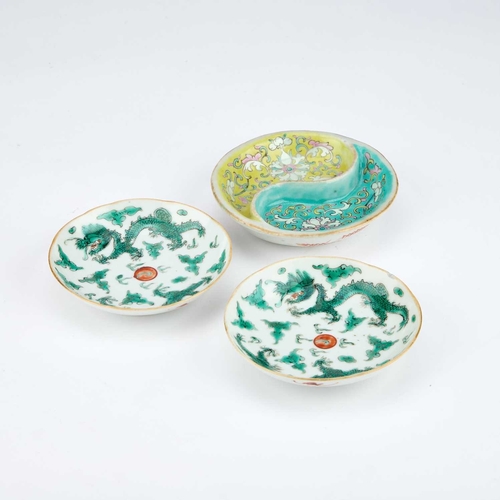 934 - A PAIR OF CHINESE 'DRAGON' DISHES each green painted with two dragons and a flaming pearl; together ... 