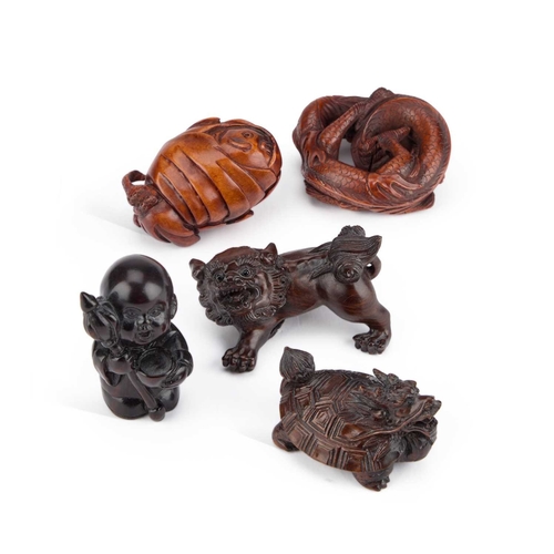 969 - A GROUP OF JAPANESE CARVED WOOD NETSUKES including one modelled as a Komainu, another as a dragon, e... 