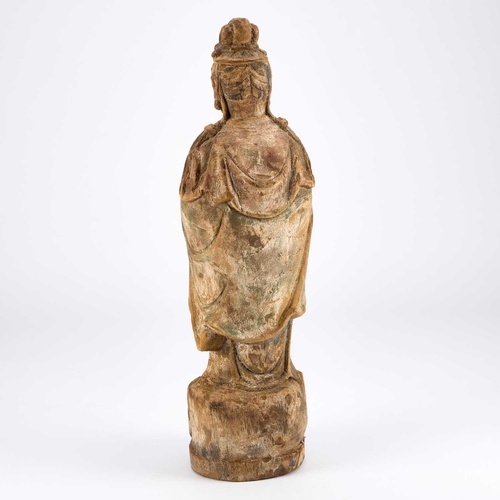 974 - A LARGE CARVED WOODEN FIGURE OF GUANYIN probably Ming Dynasty, the deity depicted standing in long f... 