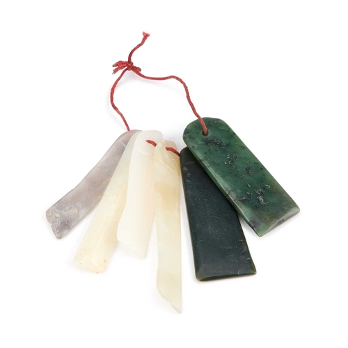 977 - A STRING OF CHINESE JADE PENDANTS the six pendants simply strung. Longest pendant 10cm