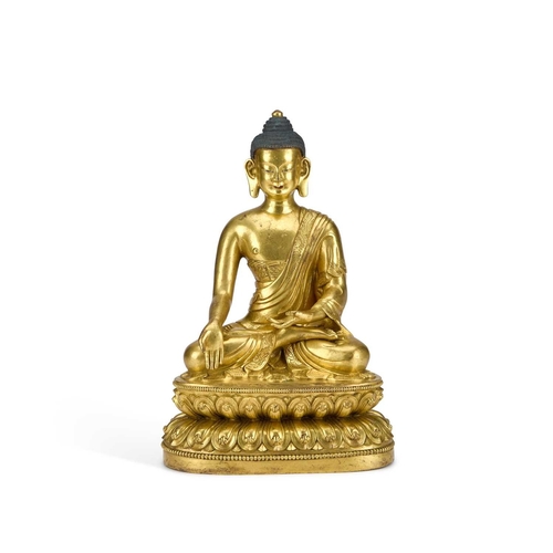 979 - A GILT-BRONZE SEATED FIGURE OF BUDDHA 18TH CENTURY OR EARLIER wearing a voluminous, well-defined san... 