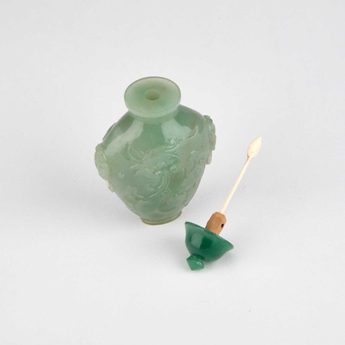 984 - A CHINESE CARVED JADE SNUFF BOTTLE Late Qing Dynasty, the body carved with a phoenix. 7.2cm high... 