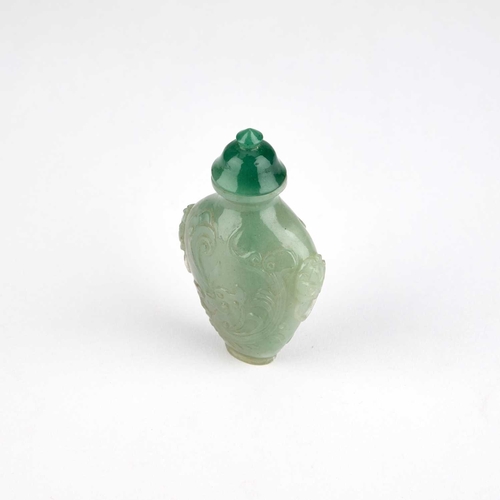 984 - A CHINESE CARVED JADE SNUFF BOTTLE Late Qing Dynasty, the body carved with a phoenix. 7.2cm high... 