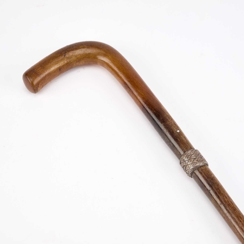 987 - A 19TH CENTURY RHINOCEROS HORN CANE with an unmarked basketweave collar. 69cm longNote: as this lot ... 