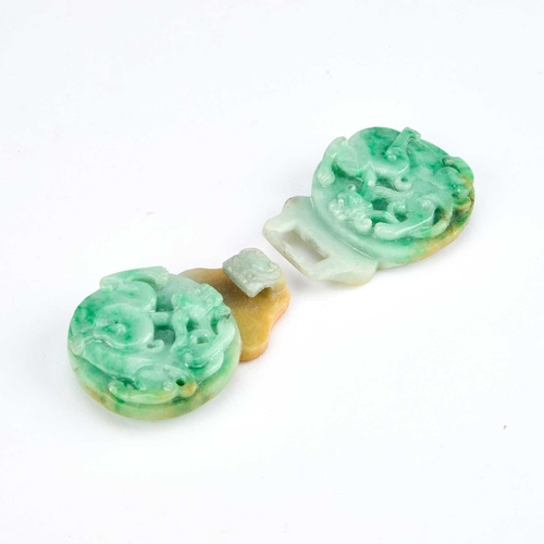 993 - A CHINESE JADE BELT BUCKLE, QING DYNASTY carved to depict coiled chilongs amongst lingzhi sprays, on... 