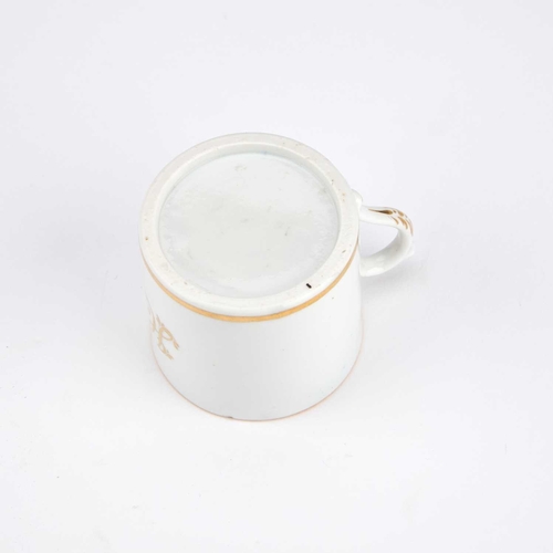 130 - A 19TH CENTURY MINIATURE MUG with the initials JC in gilt. 4.5cm high