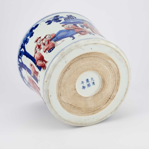 138 - A CHINESE COPPER-RED AND UNDERGLAZE BLUE PORCELAIN BRUSHPOT, BITONG the waisted sides painted with s... 