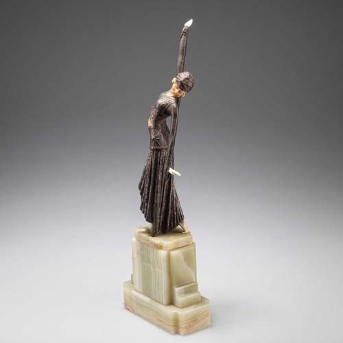 204 - AN ART DECO BRONZE AND FAUX IVORY FIGURE on a stepped onyx base, (a/f). 39.5cm highHead detached wit... 