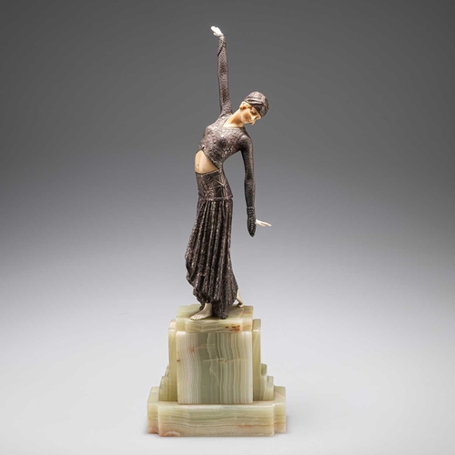 204 - AN ART DECO BRONZE AND FAUX IVORY FIGURE on a stepped onyx base, (a/f). 39.5cm highHead detached wit... 