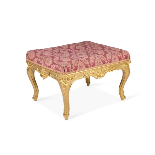 283 - A VICTORIAN GILDED AND UPHOLSTERED STOOL, LABEL OF GILL & REIGATE, LONDON rectangular, raised on cab... 