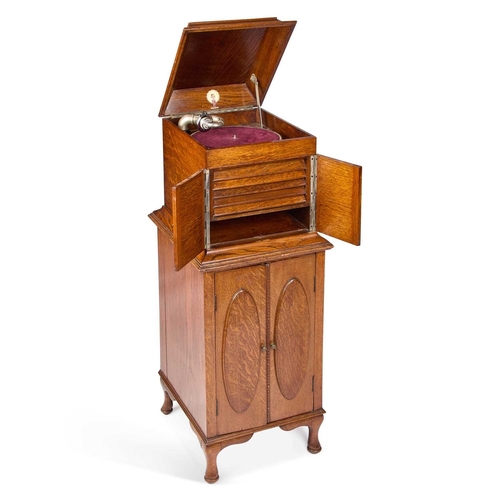 285 - AN EARLY 20TH CENTURY OAK CASED ROBEY GRAMOPHONE the oak case with a hinged cover above a pair of do... 