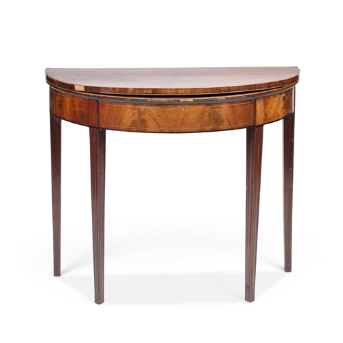 286 - A GEORGE III MAHOGANY FOLDOVER DEMILUNE CARD TABLE raised on moulded square-section tapering legs. 7... 