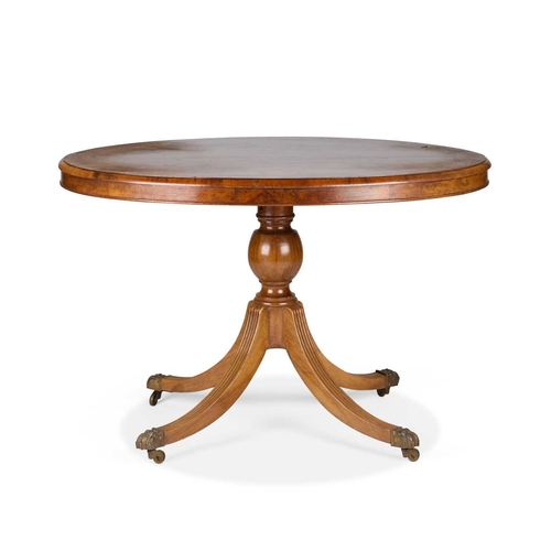 287 - A BURR WALNUT TILT-TOP LOO TABLE the Victorian oval top raised on a later base with reeded downswept... 