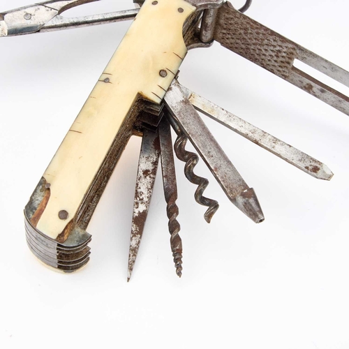 127 - § AN OVERSIZED 19TH CENTURY COACHMAN'S MULTI BLADE FOLDING POCKET KNIFE having an ivory-mounted hand... 