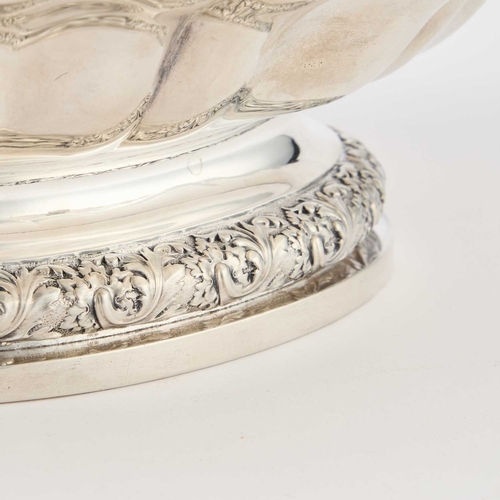 145 - A GEORGE IV SILVER CAKE BASKET by Paul Storr, London 1820, of lobed and fluted boat form, on a pedes... 