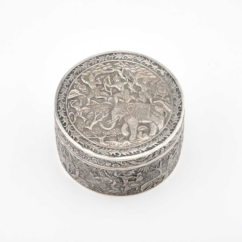 150 - A BURMESE SILVER BOX, EARLY 20TH CENTURY circular with a pull-off cover, chased with figures, dragon... 