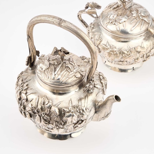 157 - A JAPANESE SILVER THREE-PIECE TEA SERVICE Meiji period (1868-1912), comprising a teapot, cream jug a... 